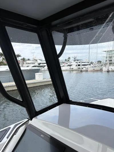 Hull 106 Yacht Photos Pics View from inside a 2025 Hammer Yachts HammerCat 30, overlooking a marina.