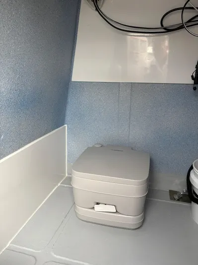 Hull 106 Yacht Photos Pics Compact bathroom area in 2025 Hammer Yachts HammerCat 30 with portable toilet.