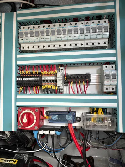 Hull 106 Yacht Photos Pics Electrical panel of 2025 Hammer Yachts HammerCat 30 with circuit breakers and wiring.