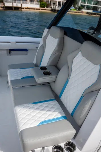 Hull 106 Yacht Photos Pics 2025 Hammer Yachts HammerCat 30 interior seating with quilted design and cup holders.