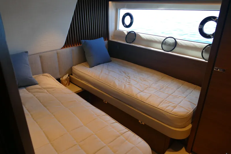  Yacht Photos Pics Interior of 2022 Princess Y72 yacht with twin beds.