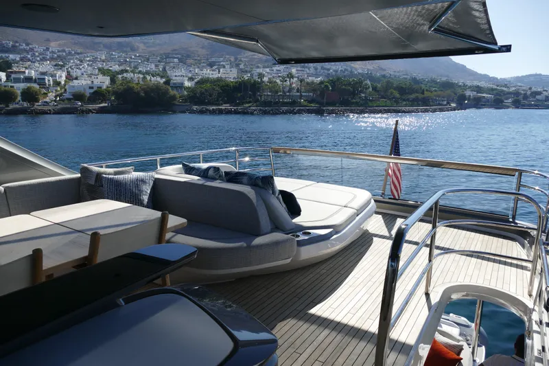  Yacht Photos Pics Luxury yacht Princess Y72, 2022, overlooking coastal scenery.