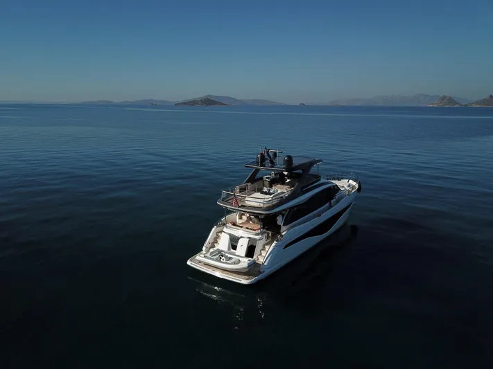  Yacht Photos Pics Luxury yacht Princess Y72 2022 on calm sea under clear sky.