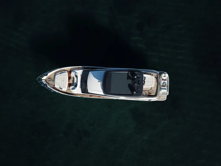  Yacht Photos Pics Aerial view of 2022 Princess Y72 yacht on dark water.