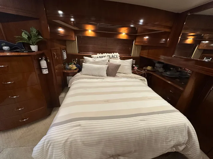  Yacht Photos Pics Luxurious bedroom interior of 2005 Carver 56 Voyager yacht with cozy bedding.