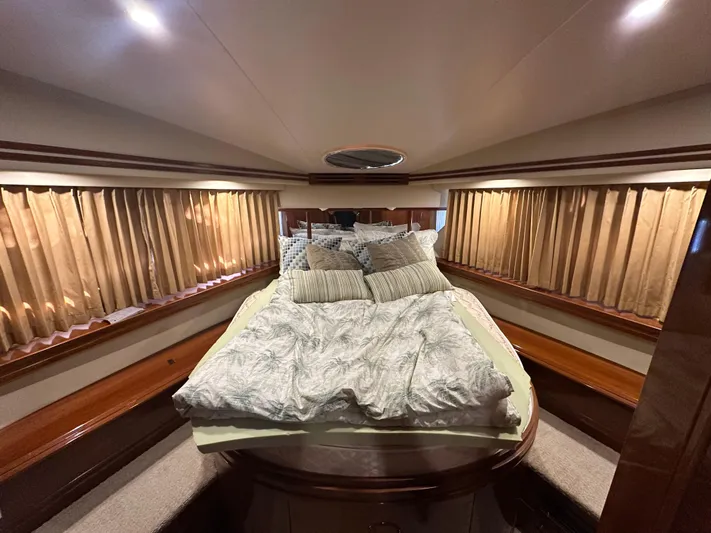  Yacht Photos Pics Luxurious bedroom interior of 2005 Carver 56 Voyager yacht with elegant bedding.