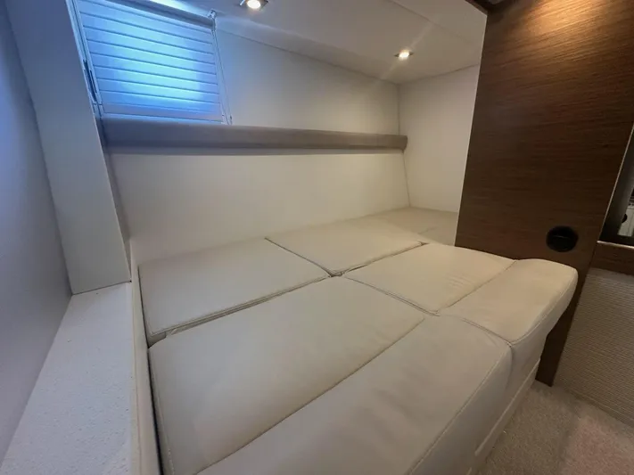 Jubilant Yacht Photos Pics Interior cabin of 2015 Cruisers Yachts 45 Cantius with beige seating and wood accents.