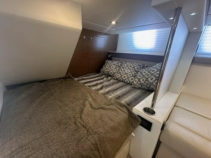 Jubilant Yacht Photos Pics Luxurious cabin interior of 2015 Cruisers Yachts 45 Cantius with cozy bedding.