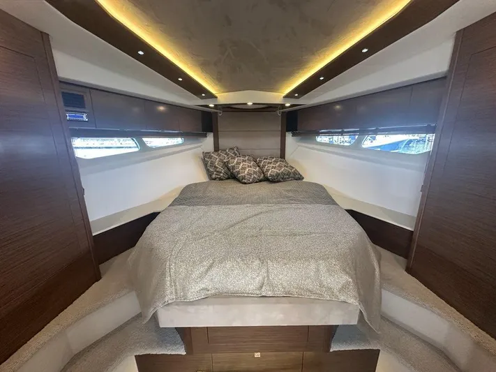 Jubilant Yacht Photos Pics Luxurious bedroom interior of 2015 Cruisers Yachts 45 Cantius with modern design and ambient lighting.