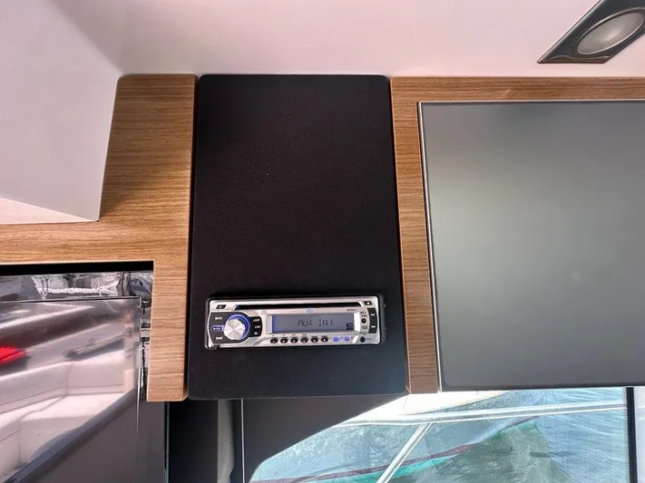 Jubilant Yacht Photos Pics Interior of 2015 Cruisers Yachts 45 Cantius with audio system and modern design.