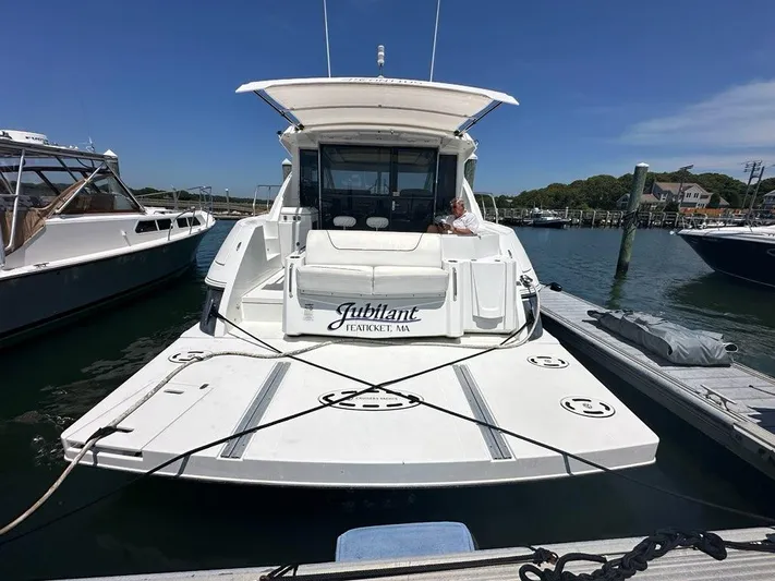 Jubilant Yacht Photos Pics 2015 Cruisers Yachts 45 Cantius docked at marina, rear view, sunny day.