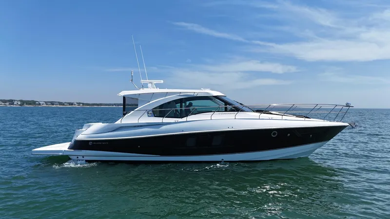 Jubilant Yacht Photos Pics 2015 Cruisers Yachts 45 Cantius on open water under clear blue sky.