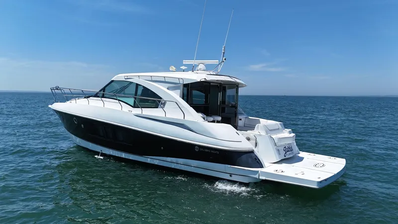 Jubilant Yacht Photos Pics 2015 Cruisers Yachts 45 Cantius on open water under clear blue sky.