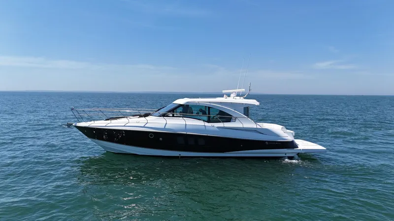Jubilant Yacht Photos Pics 2015 Cruisers Yachts 45 Cantius on open water under clear blue sky.