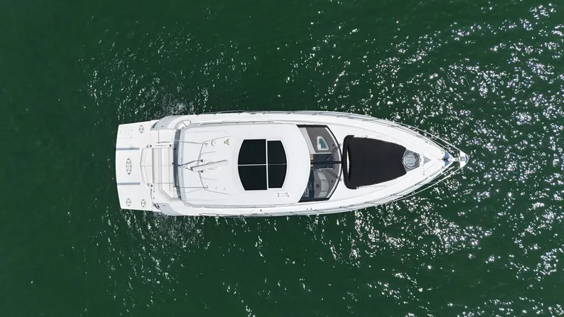Jubilant Yacht Photos Pics Aerial view of 2015 Cruisers Yachts 45 Cantius on green water.