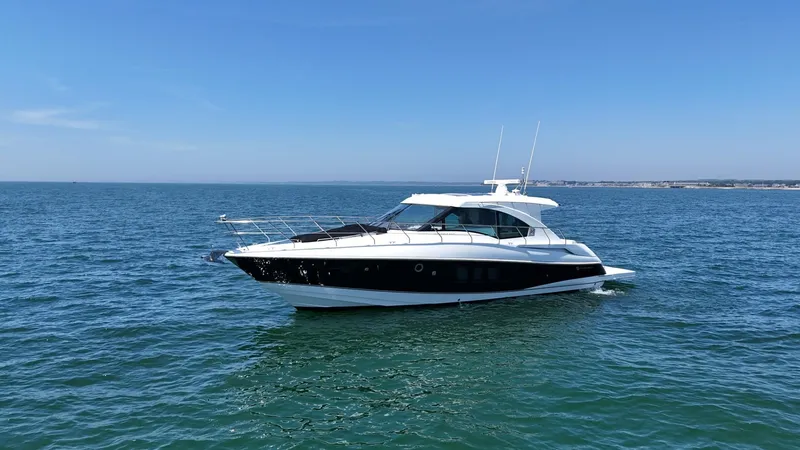 Jubilant Yacht Photos Pics 2015 Cruisers Yachts 45 Cantius on open water under clear blue sky.