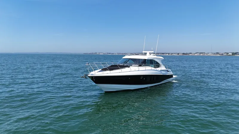 Jubilant Yacht Photos Pics 2015 Cruisers Yachts 45 Cantius on open water under clear blue sky.