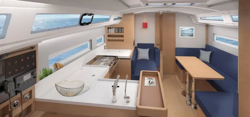  Yacht Photos Pics 2024 Jeanneau Sun Odyssey 410 interior with modern kitchen and seating area.