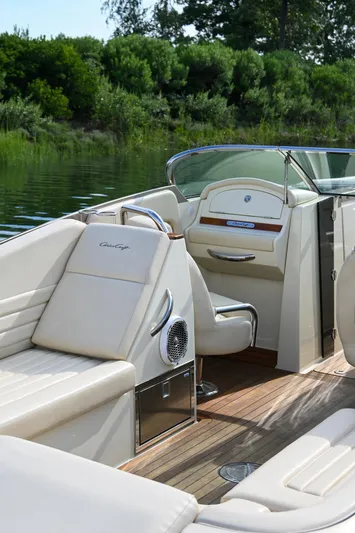  Yacht Photos Pics 2013 Chris-Craft Launch 32 boat interior with luxurious seating and wooden deck.