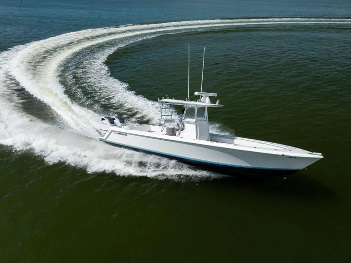  Yacht Photos Pics 2008 Contender 31 Open boat making a sharp turn on open water.