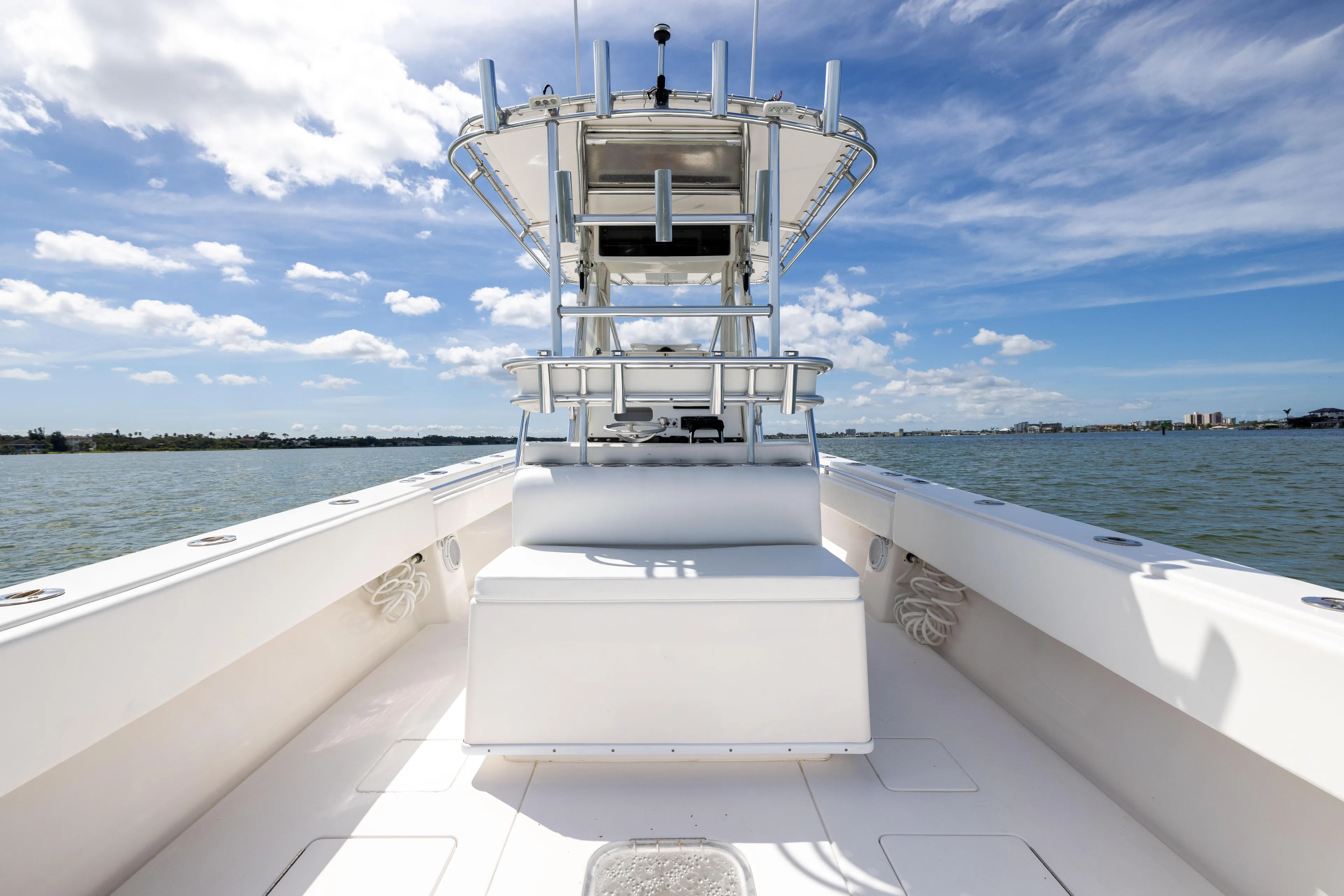  Yacht Photos Pics 2008 Contender 31 Open boat on water under blue sky.