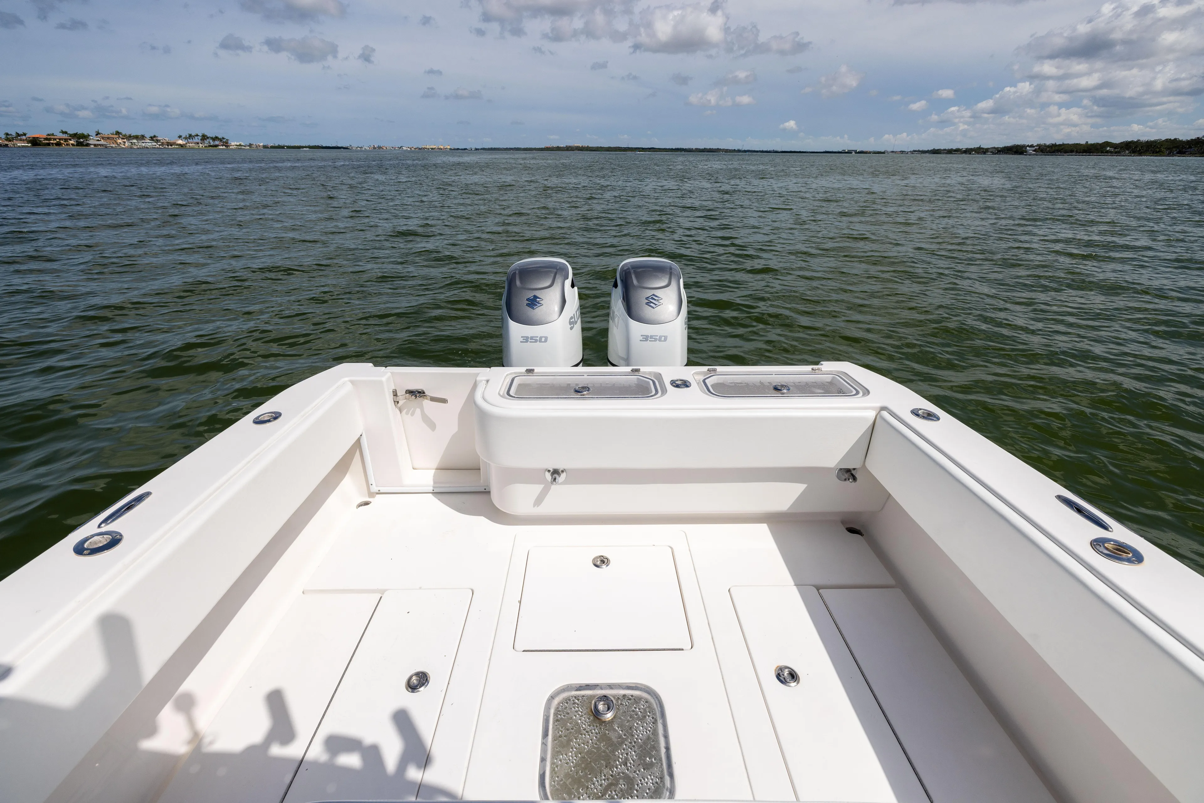  Yacht Photos Pics 2008 Contender 31 Open boat with dual outboard motors on open water.