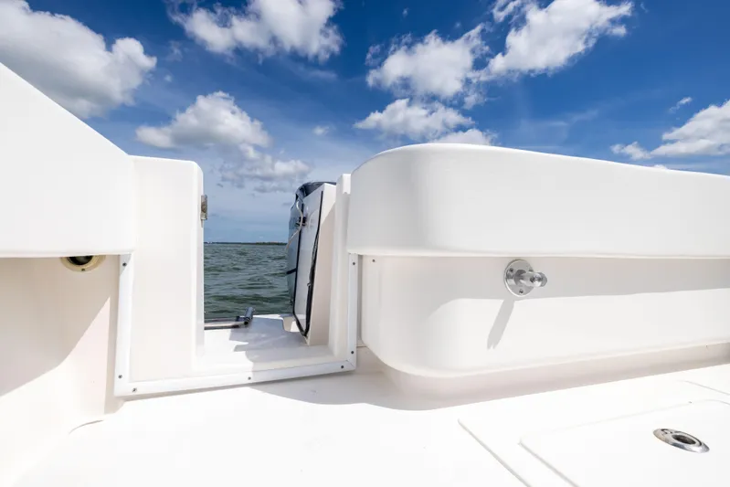  Yacht Photos Pics 2008 Contender 31 Open boat deck with ocean view and blue sky.