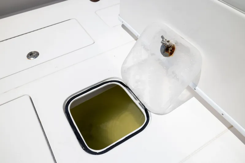  Yacht Photos Pics Open hatch on 2008 Contender 31 Open boat deck, showing interior compartment.