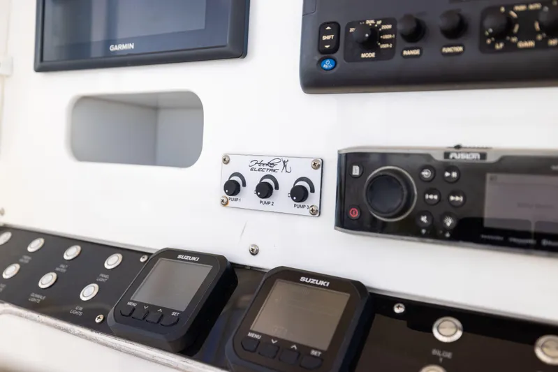  Yacht Photos Pics Control panel of a 2008 Contender 31 Open boat with various electronic devices.