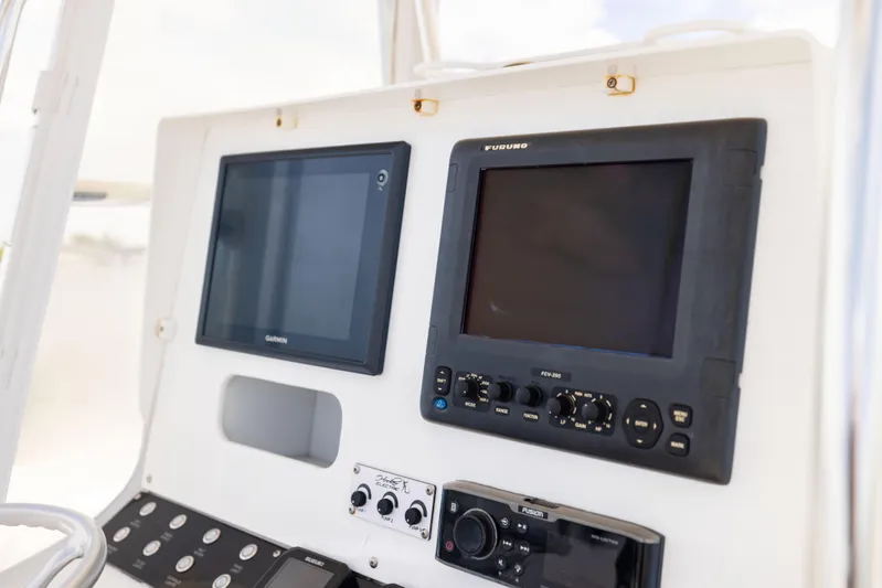  Yacht Photos Pics Control panel of 2008 Contender 31 Open boat with Garmin and Furuno displays.