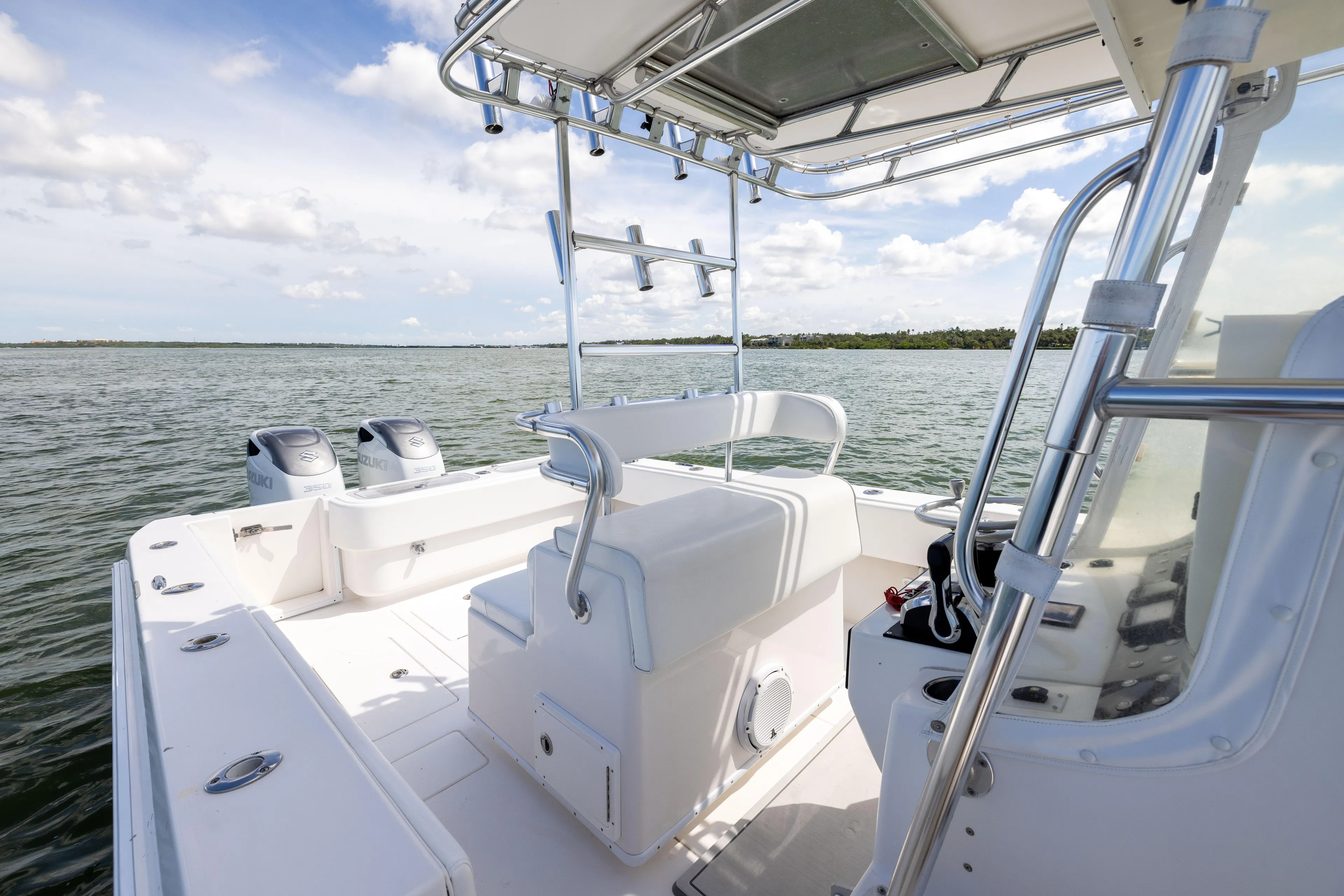  Yacht Photos Pics 2008 Contender 31 Open boat on water, featuring dual Suzuki engines and spacious deck.