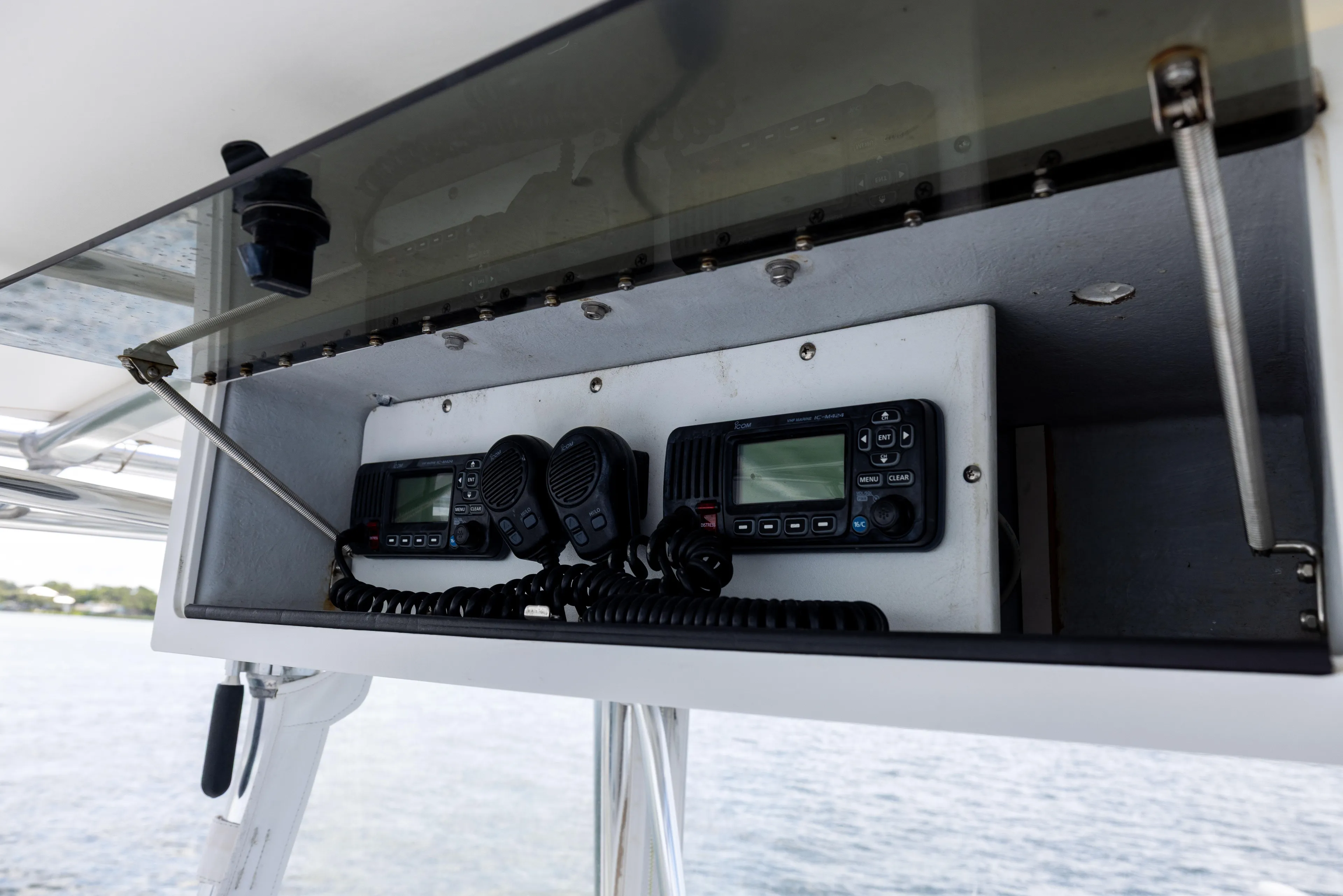  Yacht Photos Pics 2008 Contender 31 Open boat radio equipment in overhead compartment.