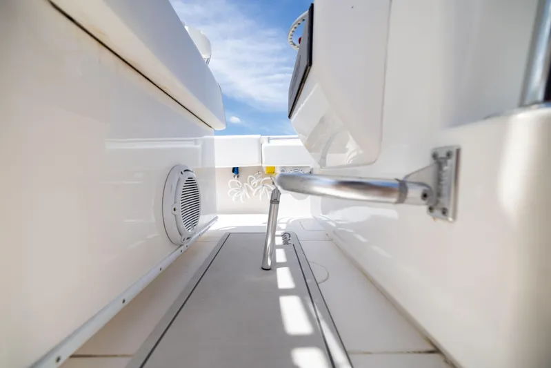  Yacht Photos Pics 2008 Contender 31 Open boat interior with sleek white design and stainless steel railing.