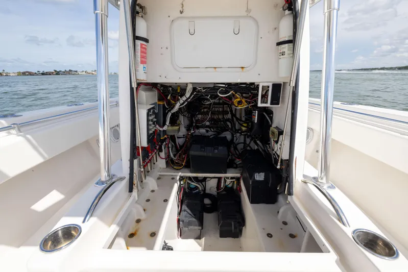  Yacht Photos Pics 2008 Contender 31 Open boat electrical compartment with wiring and equipment, ocean view in background.
