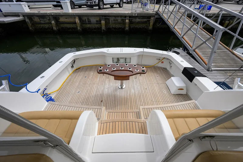  Yacht Photos Pics 2016 Viking 52 Open yacht deck with seating and fishing rod holders.