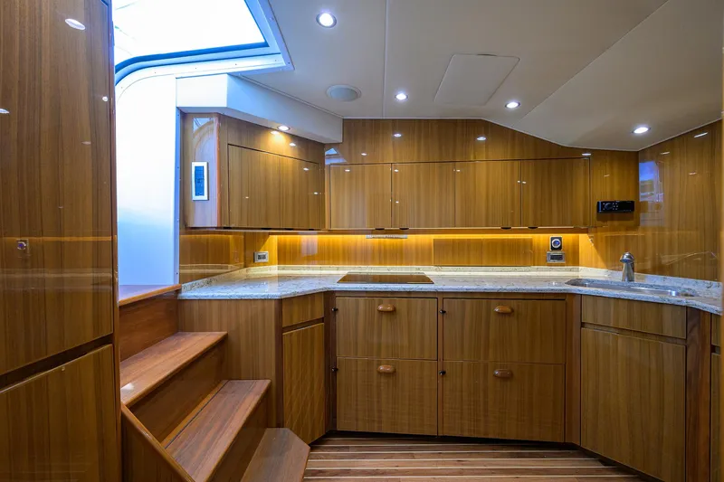  Yacht Photos Pics Luxurious wooden kitchen interior of 2016 Viking 52 Open yacht with modern lighting.