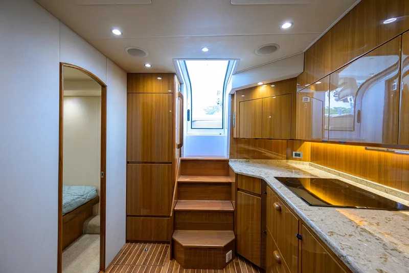 Yacht Photos Pics Interior of 2016 Viking 52 Open yacht with wooden cabinetry and modern kitchen.