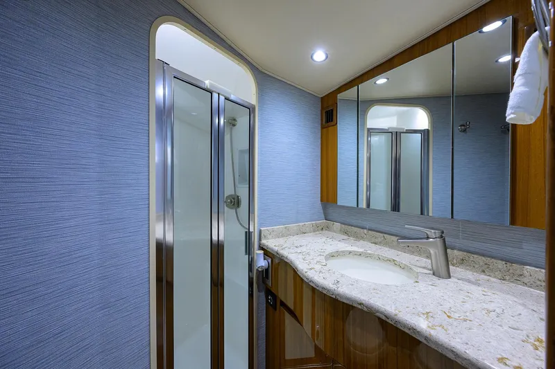  Yacht Photos Pics Luxurious bathroom in 2016 Viking 52 Open yacht with modern shower and elegant vanity.