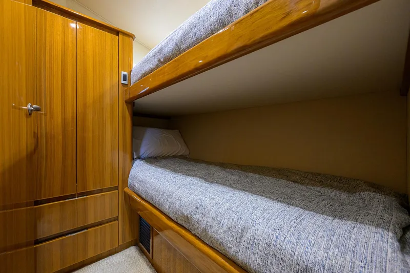  Yacht Photos Pics Bunk beds in 2016 Viking 52 Open yacht cabin with wooden cabinetry.