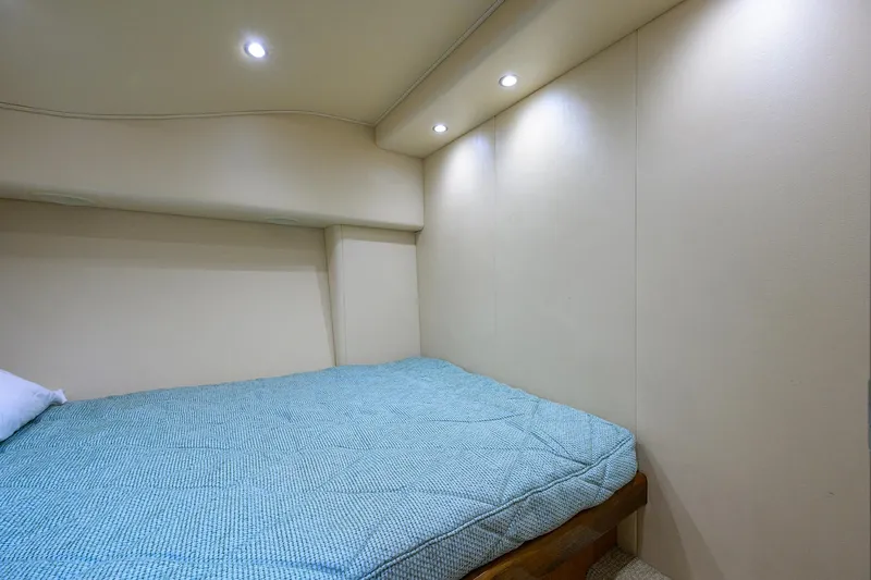  Yacht Photos Pics 2016 Viking 52 Open cabin interior with bed and recessed lighting.