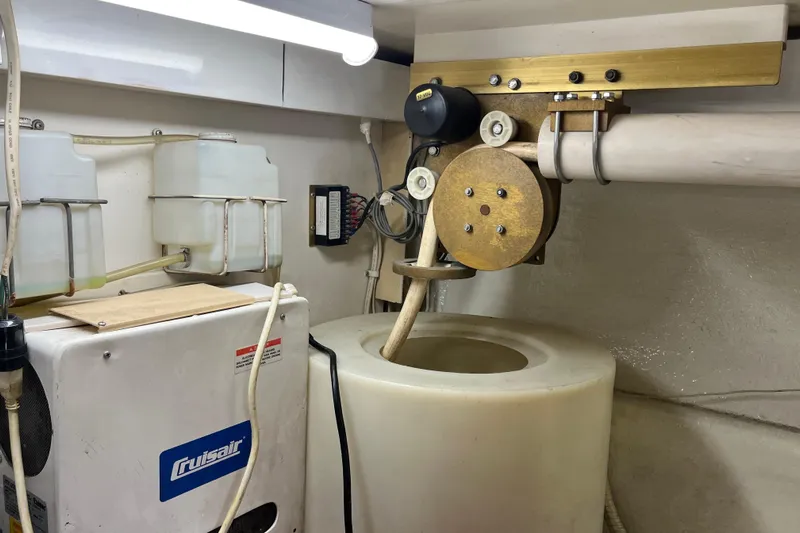 Next Yacht Photos Pics Engine room of a 1999 Post 42 Convertible boat with mechanical equipment.