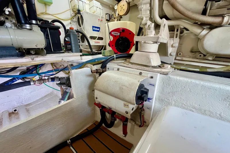 Next Yacht Photos Pics Engine room of a 1999 Post 42 Convertible boat, showcasing mechanical components and wiring.