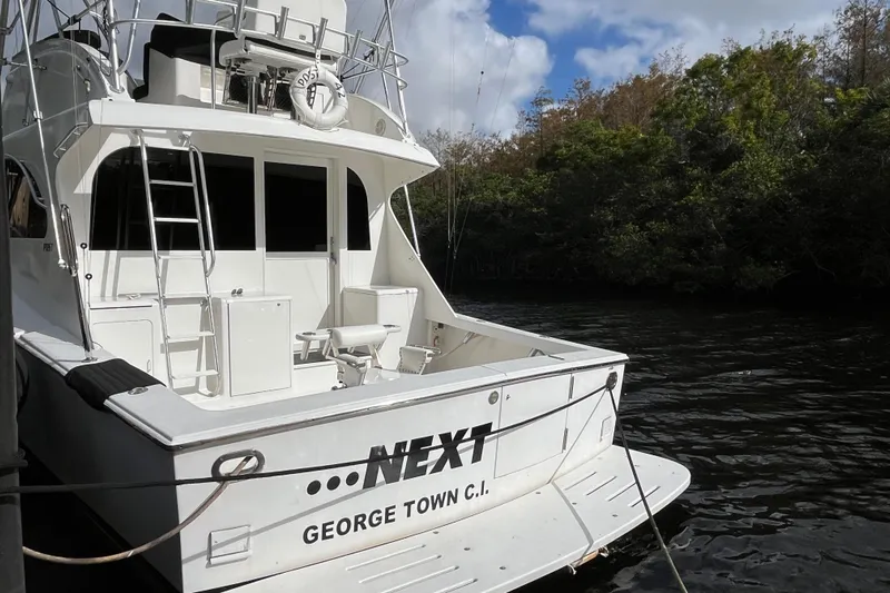 Next Yacht Photos Pics 1999 Post 42 Convertible yacht docked, named "NEXT," in George Town, C.I.