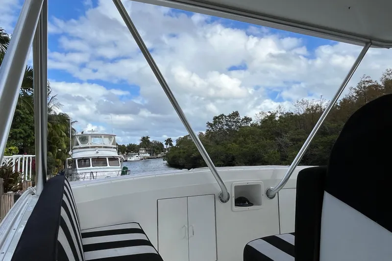 Next Yacht Photos Pics View from a 1999 Post 42 Convertible boat, overlooking a serene waterway.