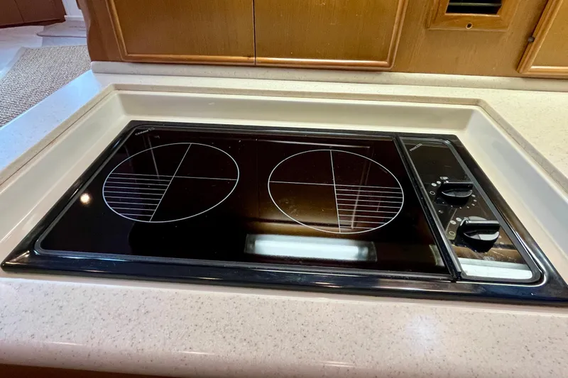 Next Yacht Photos Pics Built-in electric cooktop on a 1999 Post 42 Convertible yacht kitchen counter.