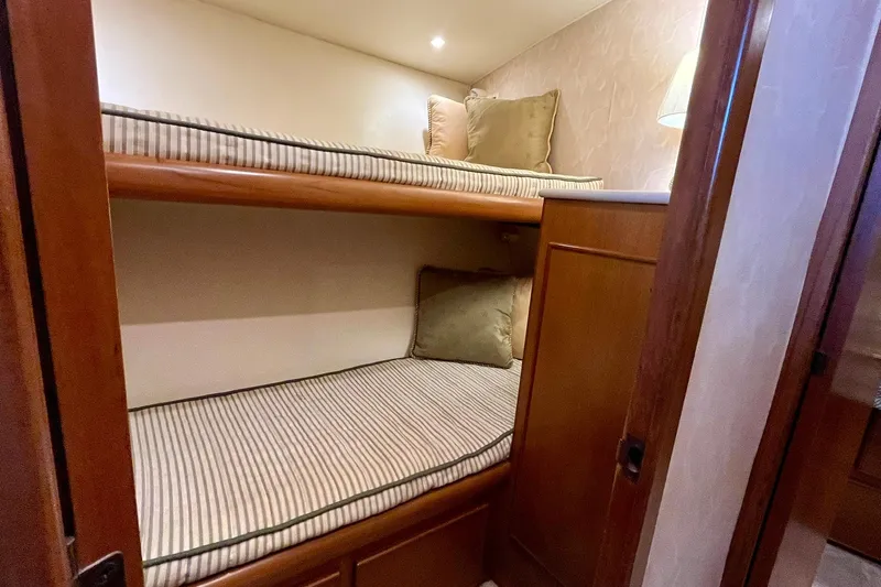 Next Yacht Photos Pics Bunk beds in 1999 Post 42 Convertible yacht cabin with wooden finish.