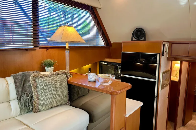 Next Yacht Photos Pics Luxurious interior of 1999 Post 42 Convertible yacht with cozy seating and modern amenities.