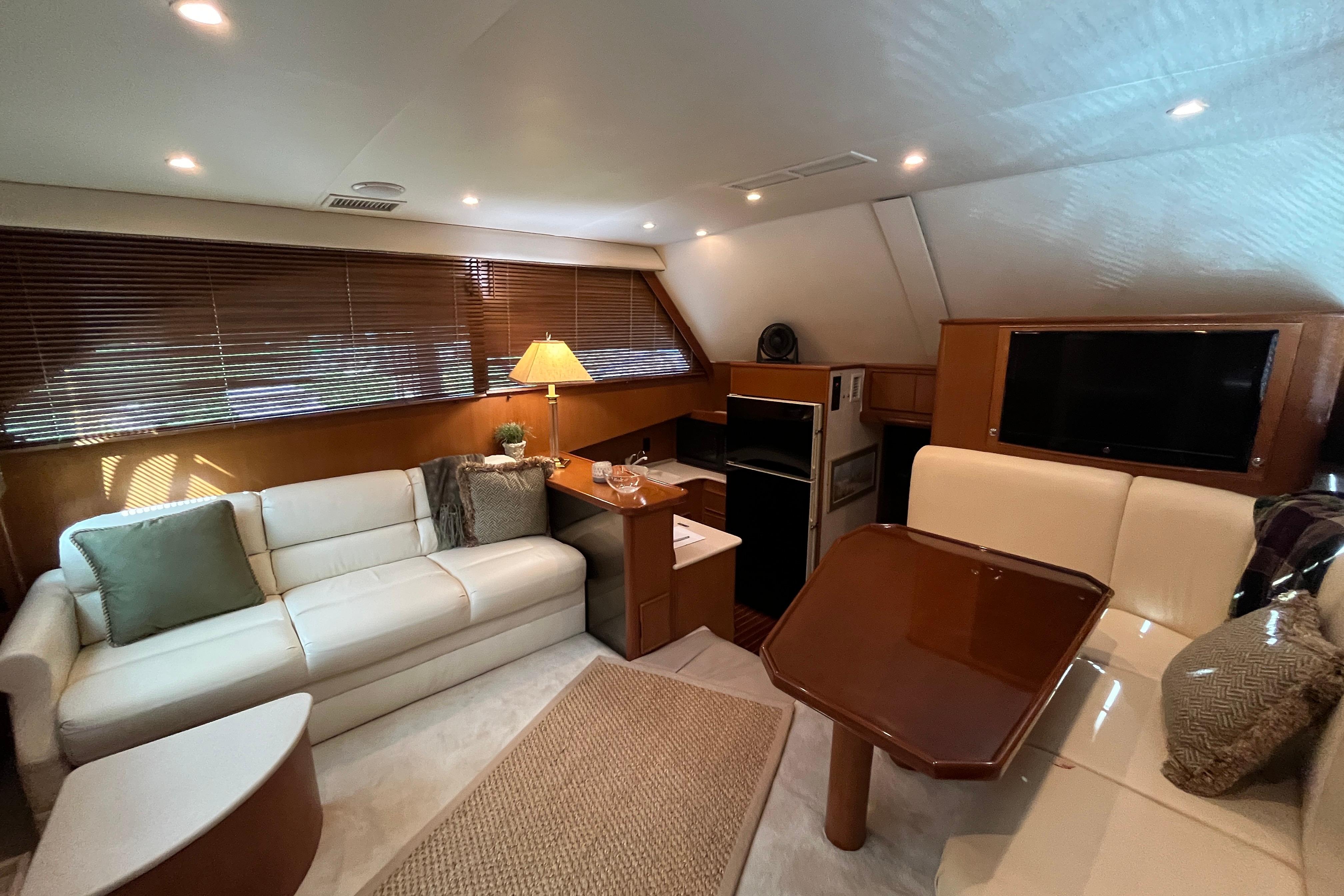 Luxurious interior of a 1999 Post 42 Convertible yacht with modern furnishings.