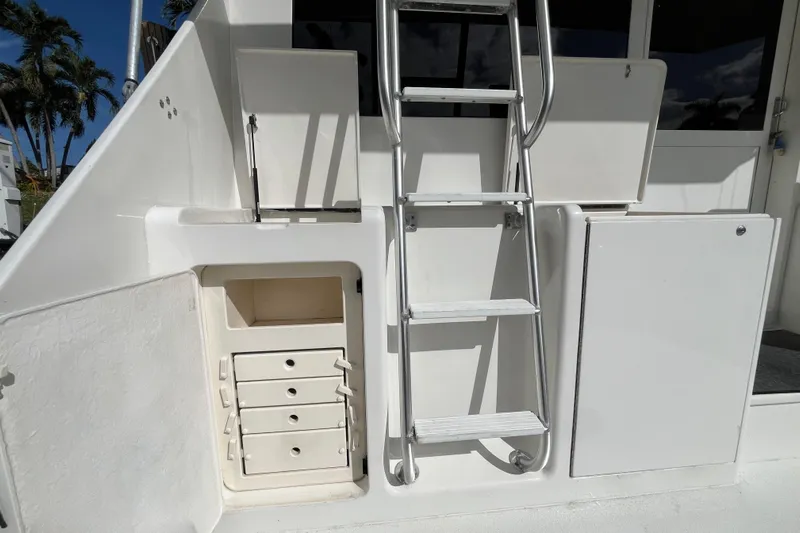 Next Yacht Photos Pics 1999 Post 42 Convertible yacht with ladder and storage compartments.