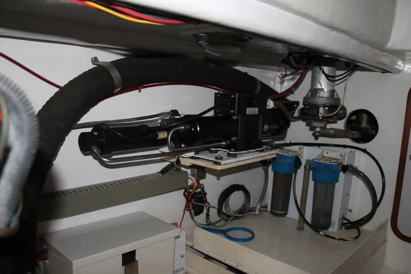 Callisto Yacht Photos Pics Engine room of a 2009 Outbound 46 yacht with mechanical components and filters.